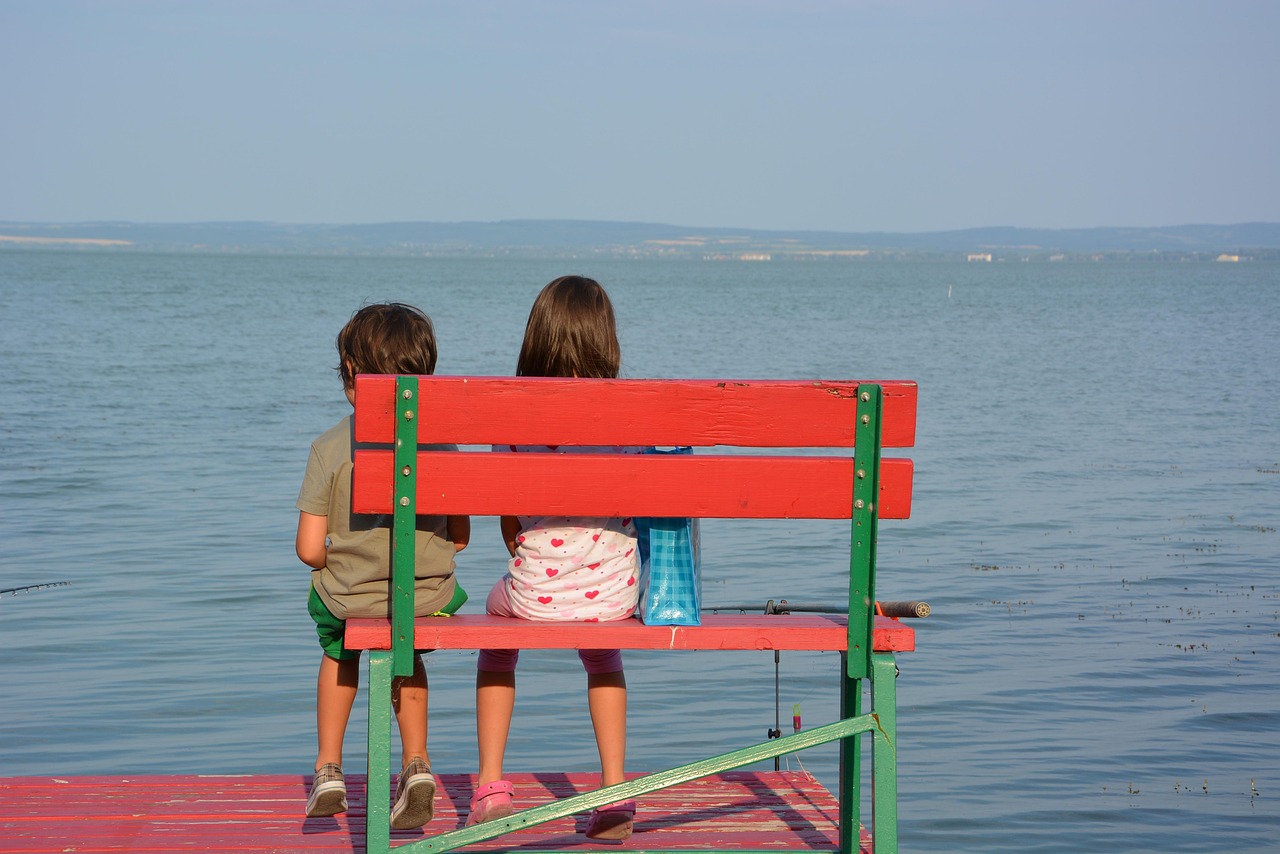 Children sitting on a seat
