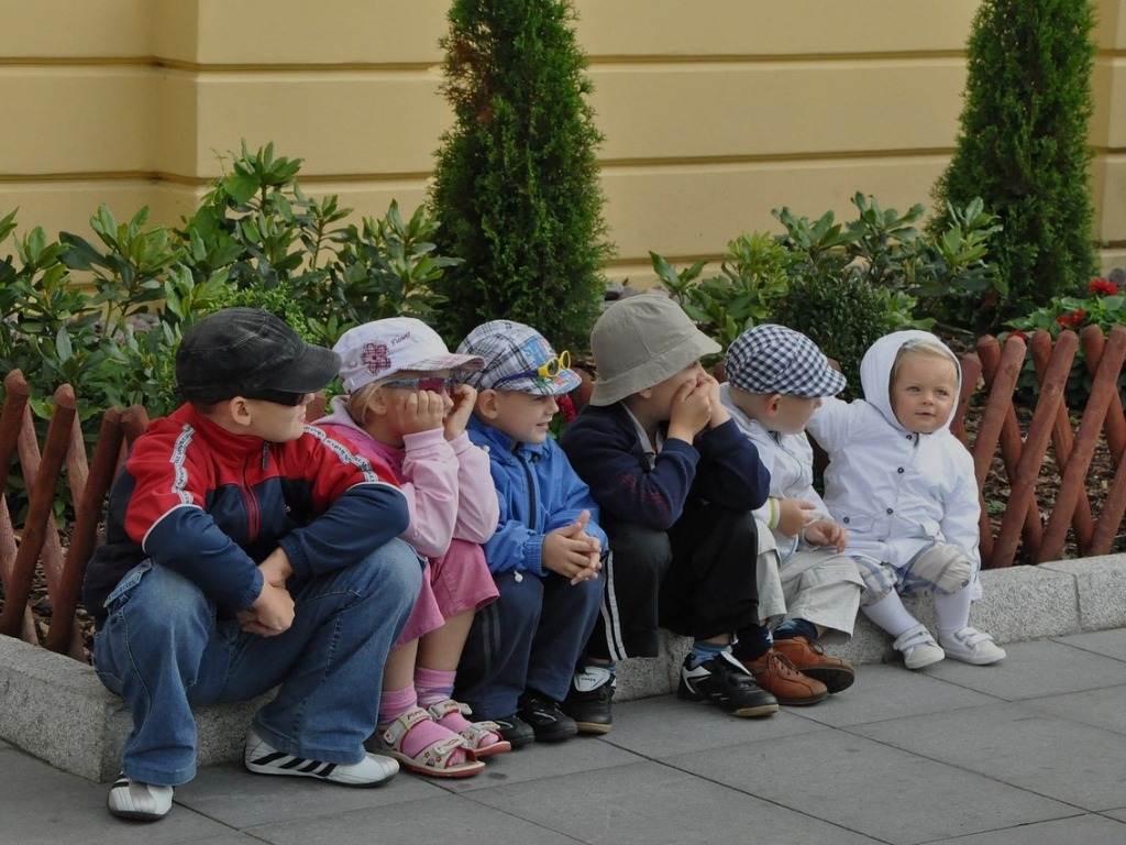 children sitting on the ground