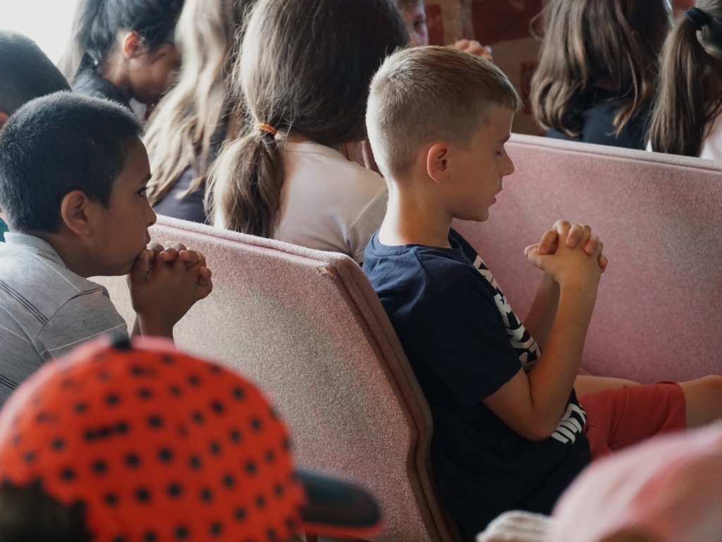 children sitting at a club
