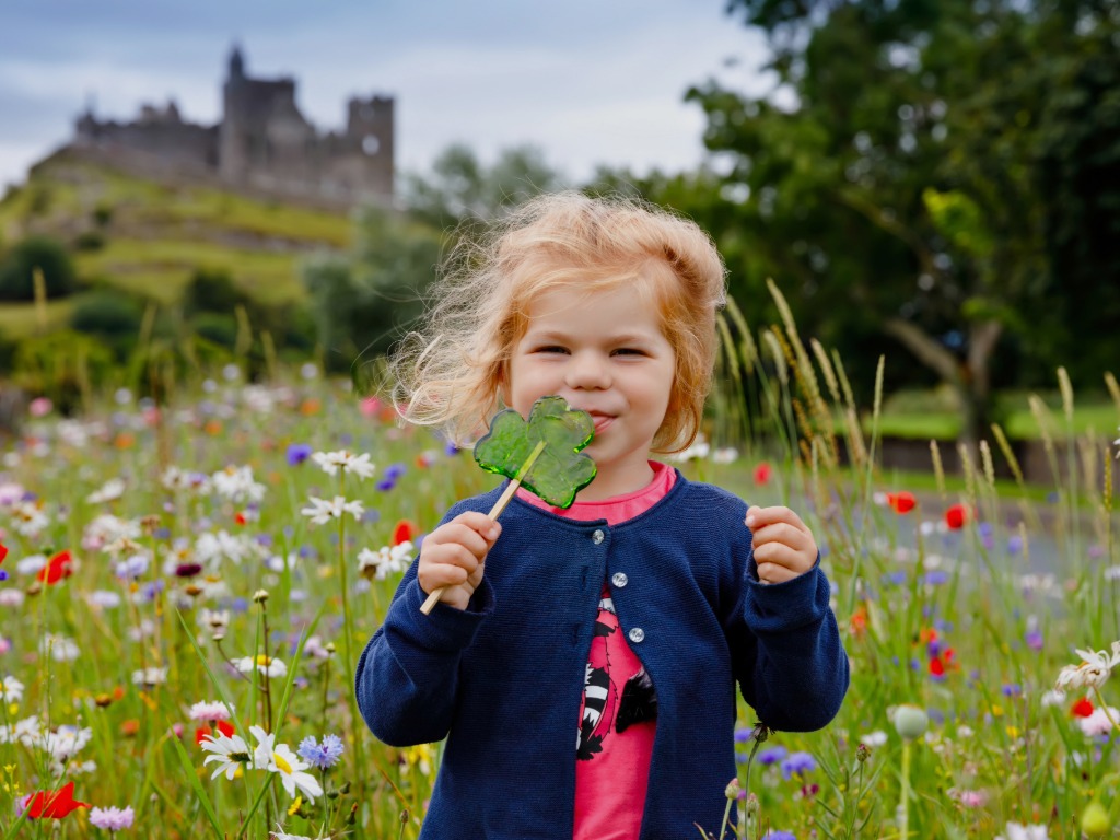 a girl eating a lolly