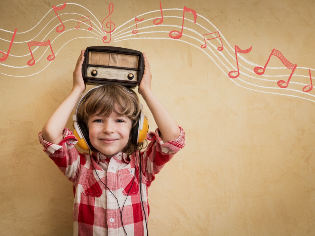 child holding a radio
