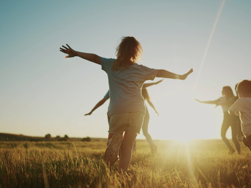 children running in a field