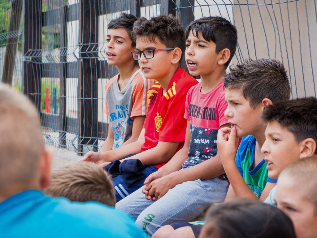 children sitting listening